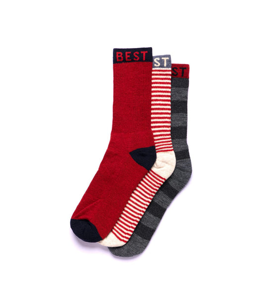 Best Made Co’s Standard Wool Socks feature red fabric with black accents on the toe, heel, and cuff. The word BEST appears in red on the black cuff, and the socks are shown against a plain white background.