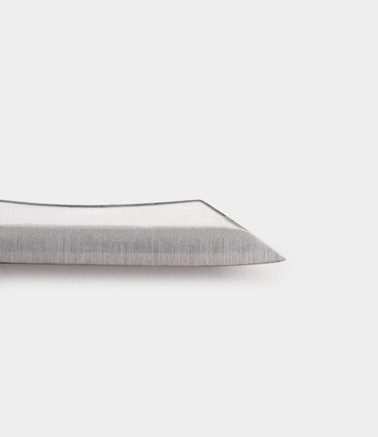 Close-up of the Mini Brass Higo Knife by Best Made Co., featuring a handmade Edo-period inspired stainless steel blade with a straight edge and angled, pointed tip, set against a plain white background.