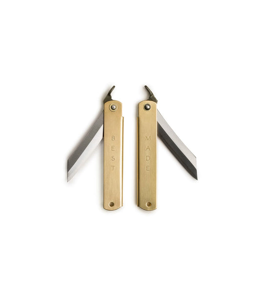 An open wooden drawer displays a Vanguard Fixed Blade by Best Made Co with its blade exposed, beside a green box labeled 