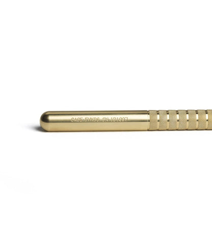 A SUPRA - Fountain Pen by Best Made Co. with a knurled grip and engraved text—CAGE: 5VKB6 SN: 131097—lies horizontally on a white background, designed to be compatible with Fisher Space Pen refills.