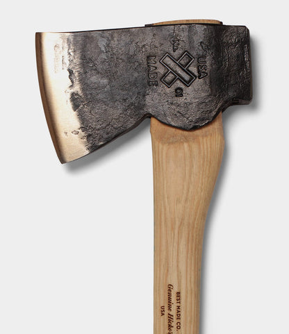 A close-up of a Best Made Co. Old Gold No. 1 axe with a hand-forged dark metal head stamped USA MADE and a wooden handle featuring the text BEST MADE CO. Genuine Hickory USA, on a white background.