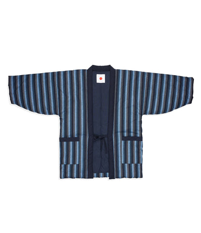 The Best Made Co. Quilted Hanten Jacket is a traditional style with wide sleeves, navy base, blue and gray stripes, front pockets, tie closure, and a red dot label inside the collar.