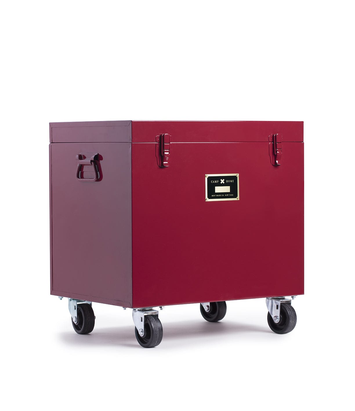A spacious, deep red Rolling Footlocker from Best Made Company Archive, this storage trunk is made of heavy-duty 22-gauge steel and features robust handles, secure metal latches, a front label, and four caster wheels for easy mobility.